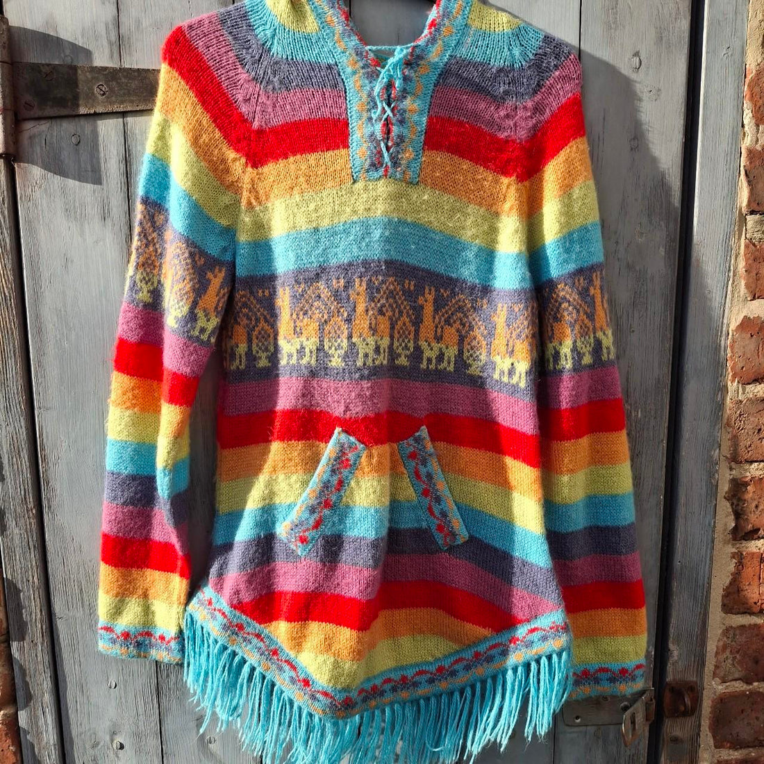Colourful Multi-Coloured Rainbow Alpaca Wool Poncho With Fringed Hem. - Festigal
