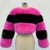 Pink and black striped fur jacket on a mannequin against a white background