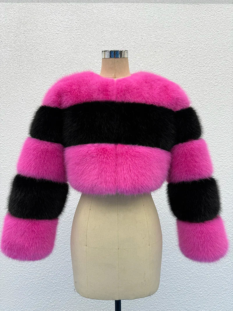 Pink and black striped fur jacket on a mannequin against a white background