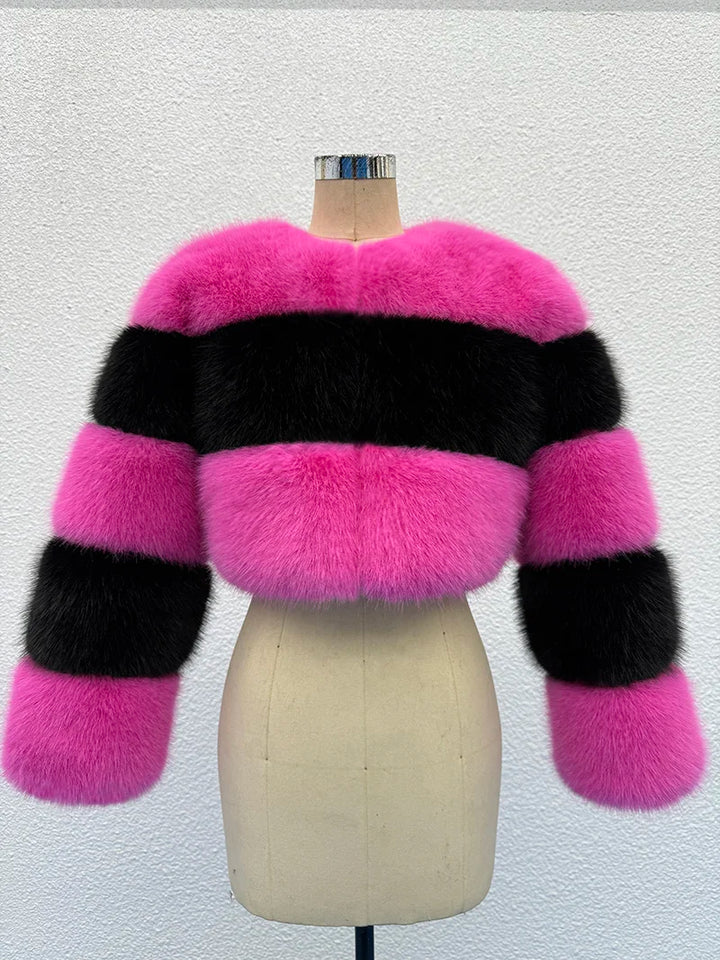 Pink and black striped fur jacket on a mannequin against a white background