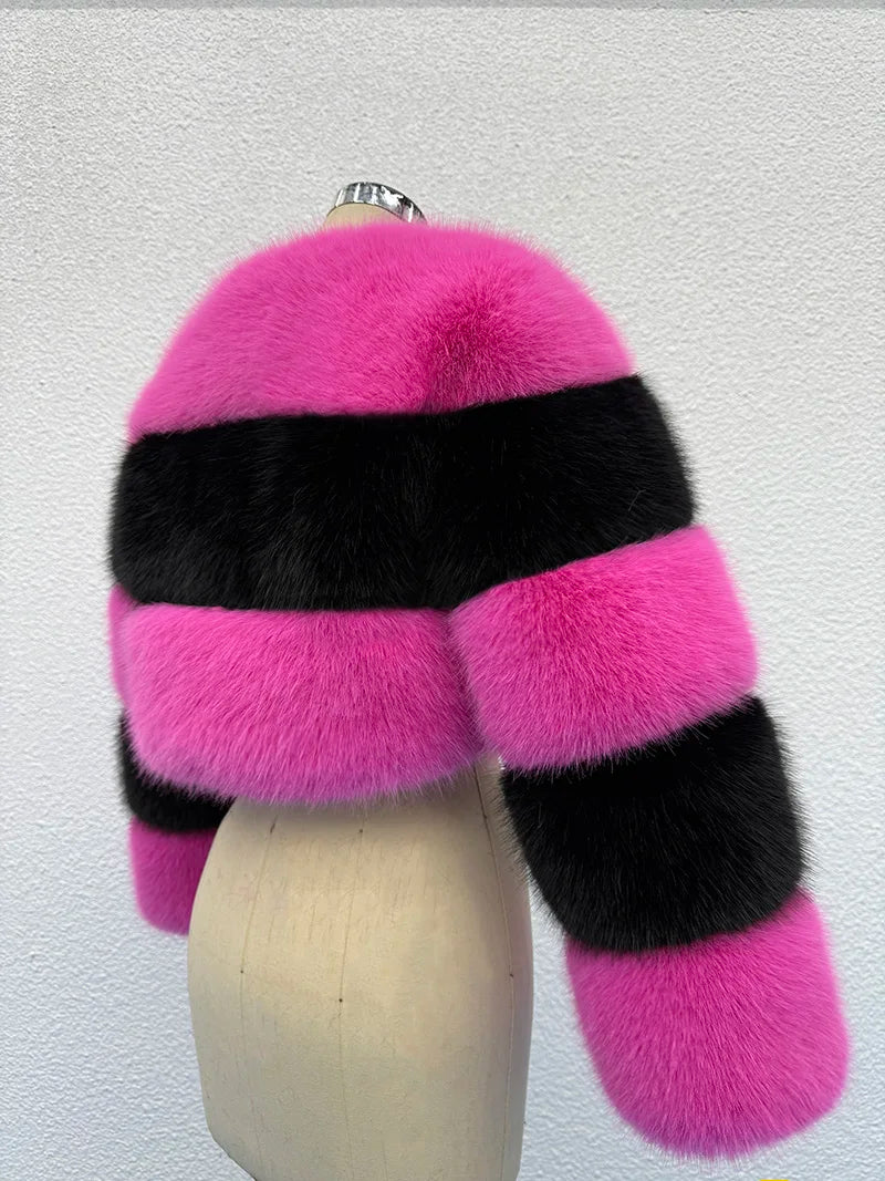 Pink and black fur scarf on a mannequin against a white background