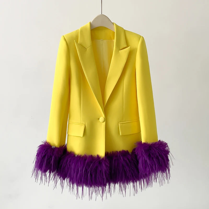 Yellow blazer with purple feathered hem on a white background
